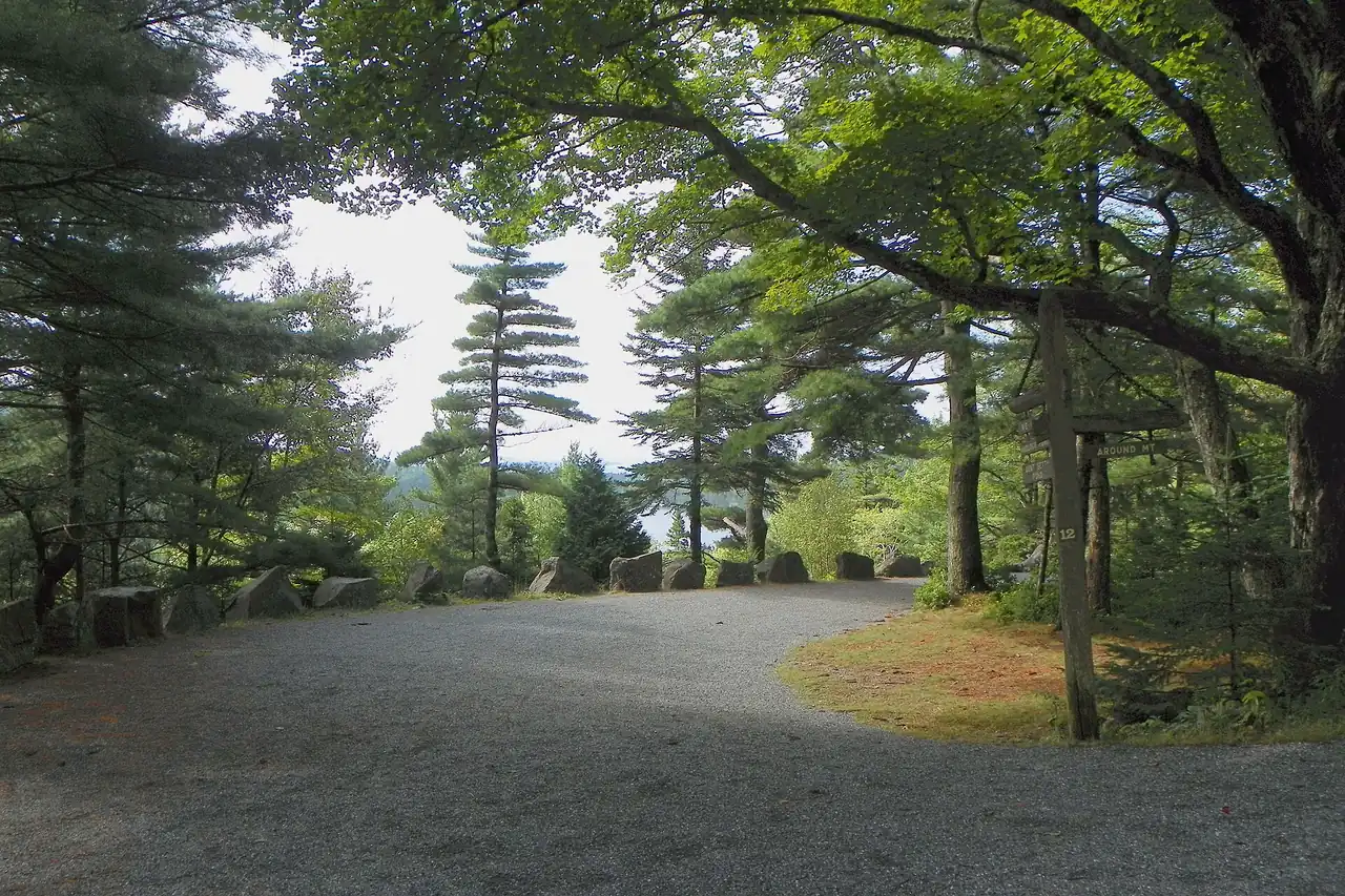 A gravel carriage road curving through the forest in Acadia National Park