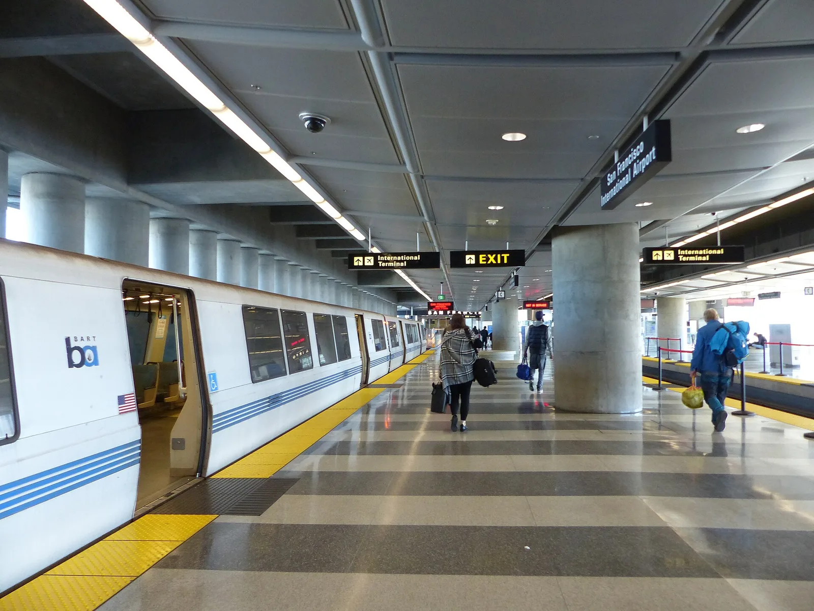 A BART train waiting at the San Francisco International Airport station platform