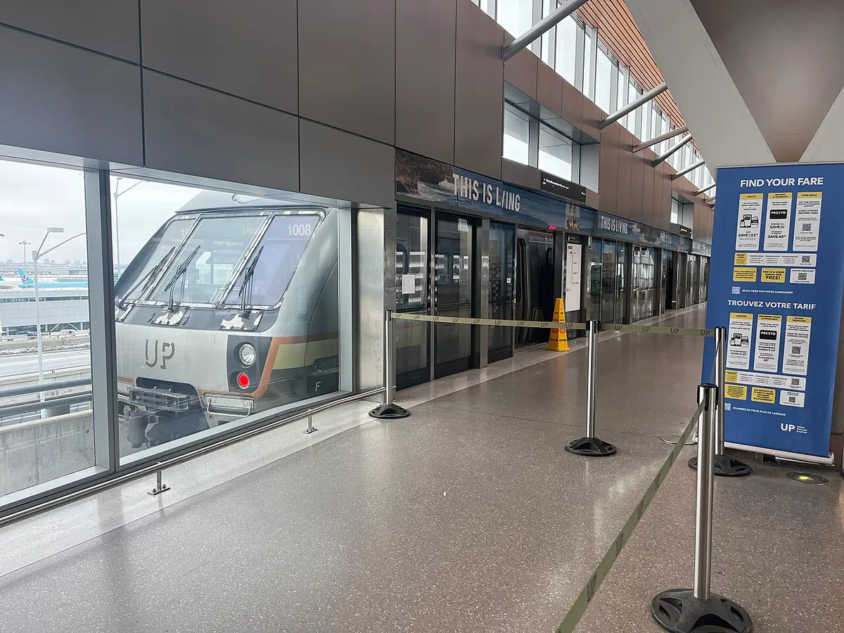A UP Express train at the platform beside Toronto Pearson airport