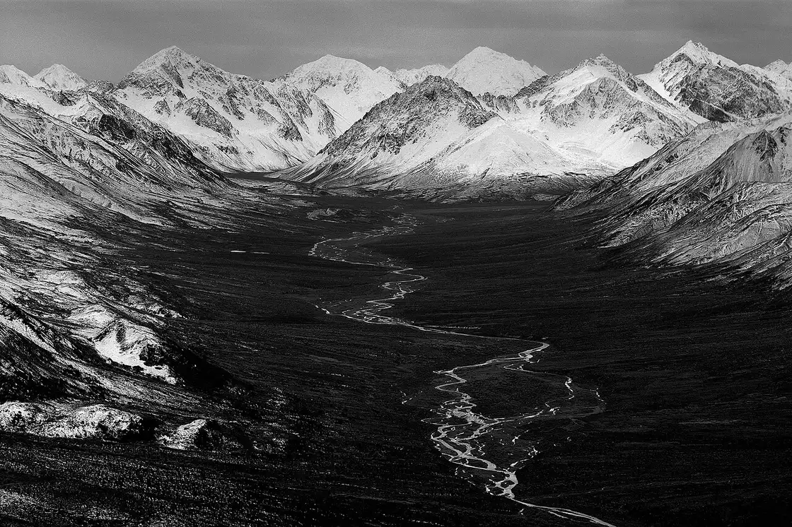The Sanctuary River braiding through tundra toward the Alaska Range in Denali