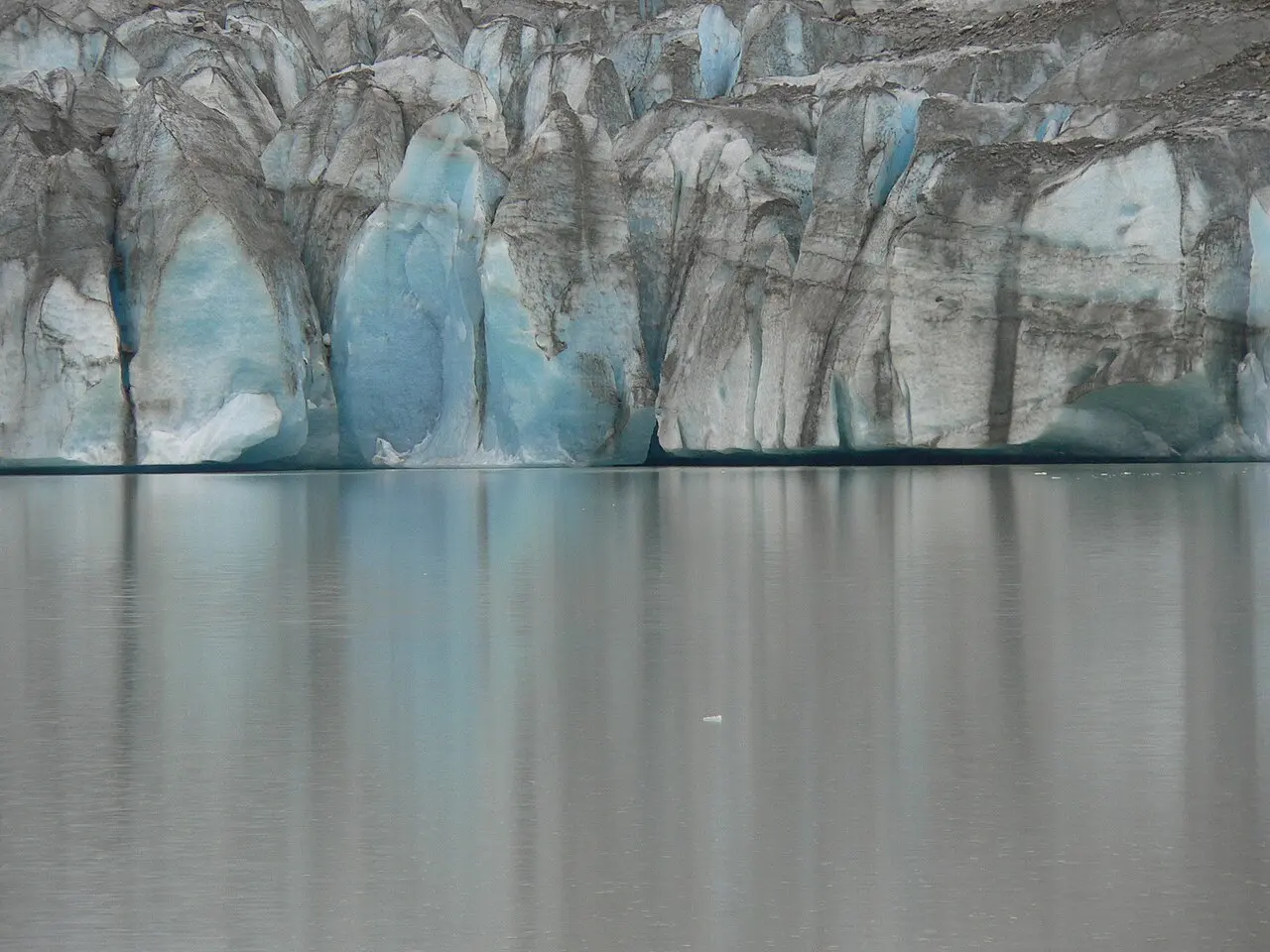 Calm water and ice at the face of a Glacier Bay tidewater glacier