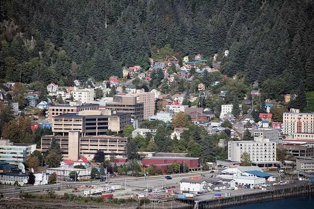Juneau waterfront and downtown with ships in the channel and mountains behind