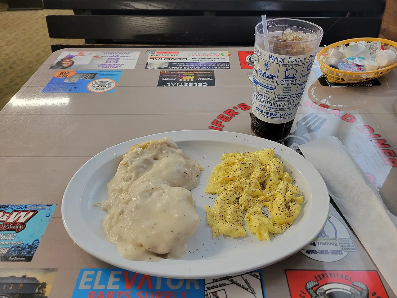 A plate of split biscuits covered in white sausage gravy at a Georgia diner