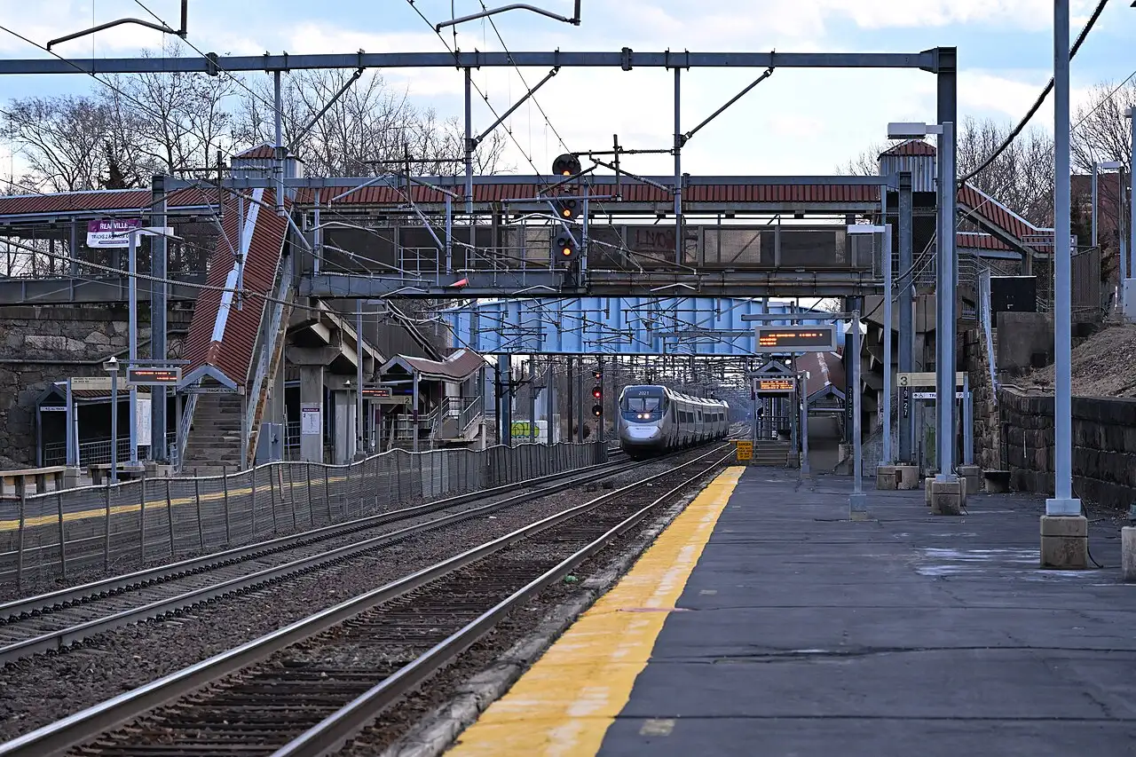 Northbound Amtrak Acela Express train on the Northeast Corridor near Readville