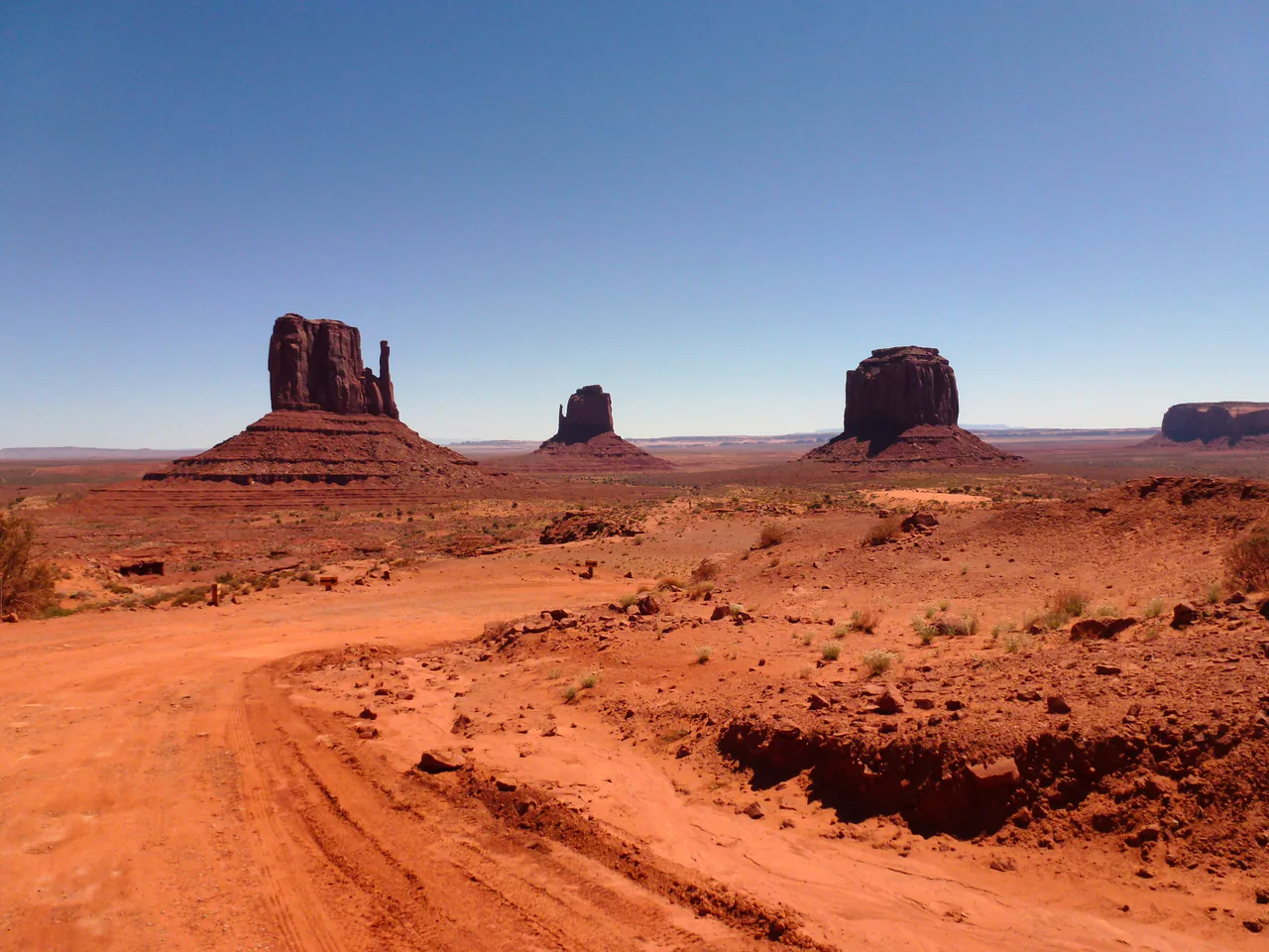 The Mitten buttes rising from the desert floor at Monument Valley Navajo Tribal Park in Arizona