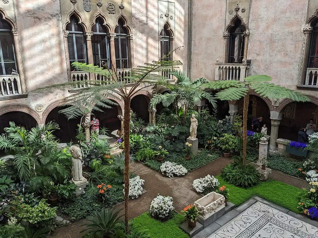 The glass-roofed courtyard garden at the center of the Isabella Stewart Gardner Museum