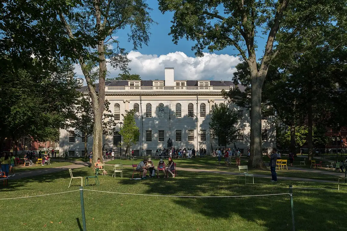 Brick dormitories and trees inside Harvard Yard in Cambridge, Massachusetts
