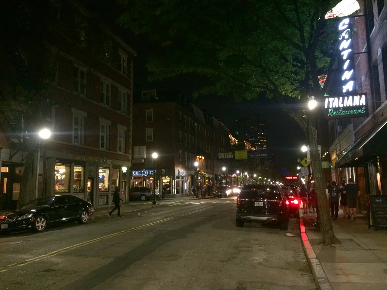 Restaurants and bars along Hanover Street in Boston's North End on a busy evening