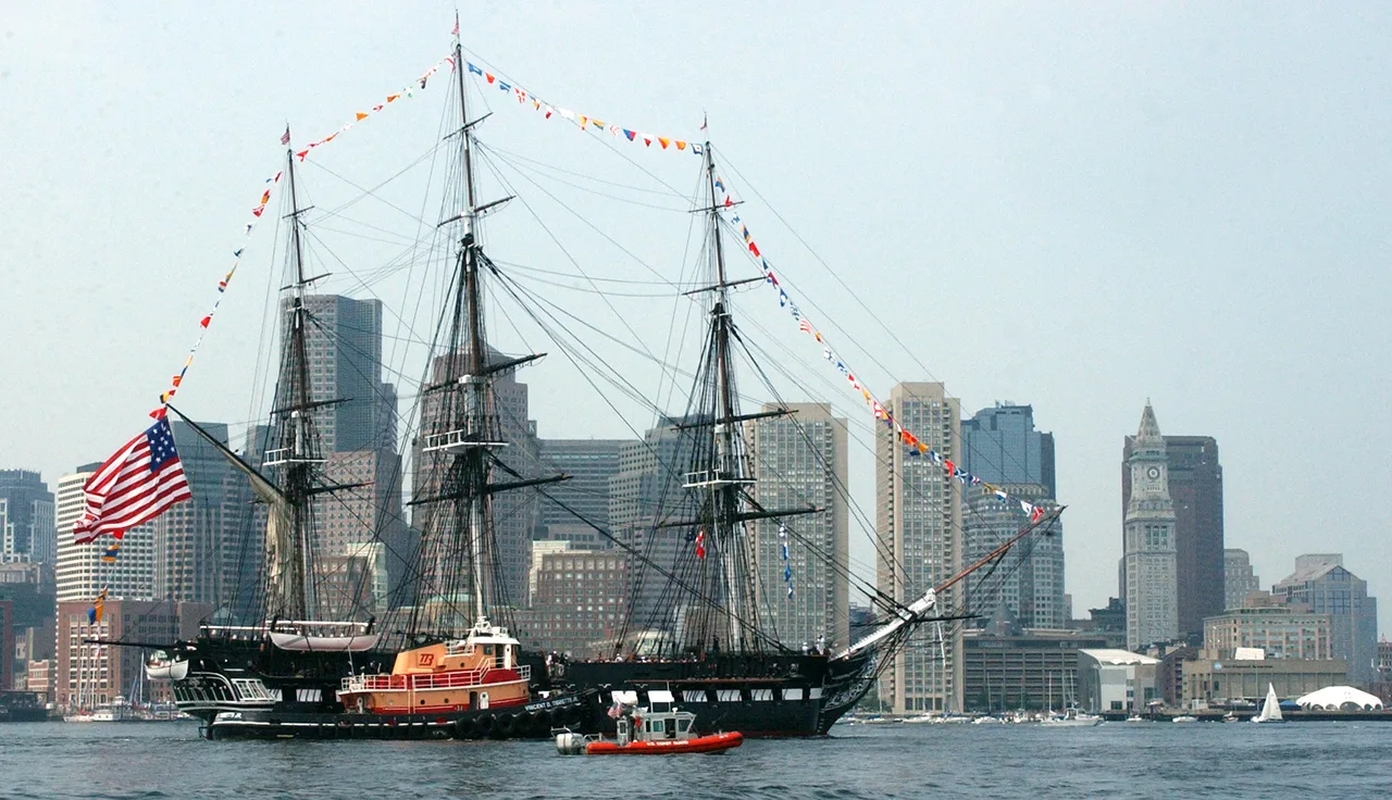 USS Constitution moored at the Charlestown Navy Yard with masts rigged
