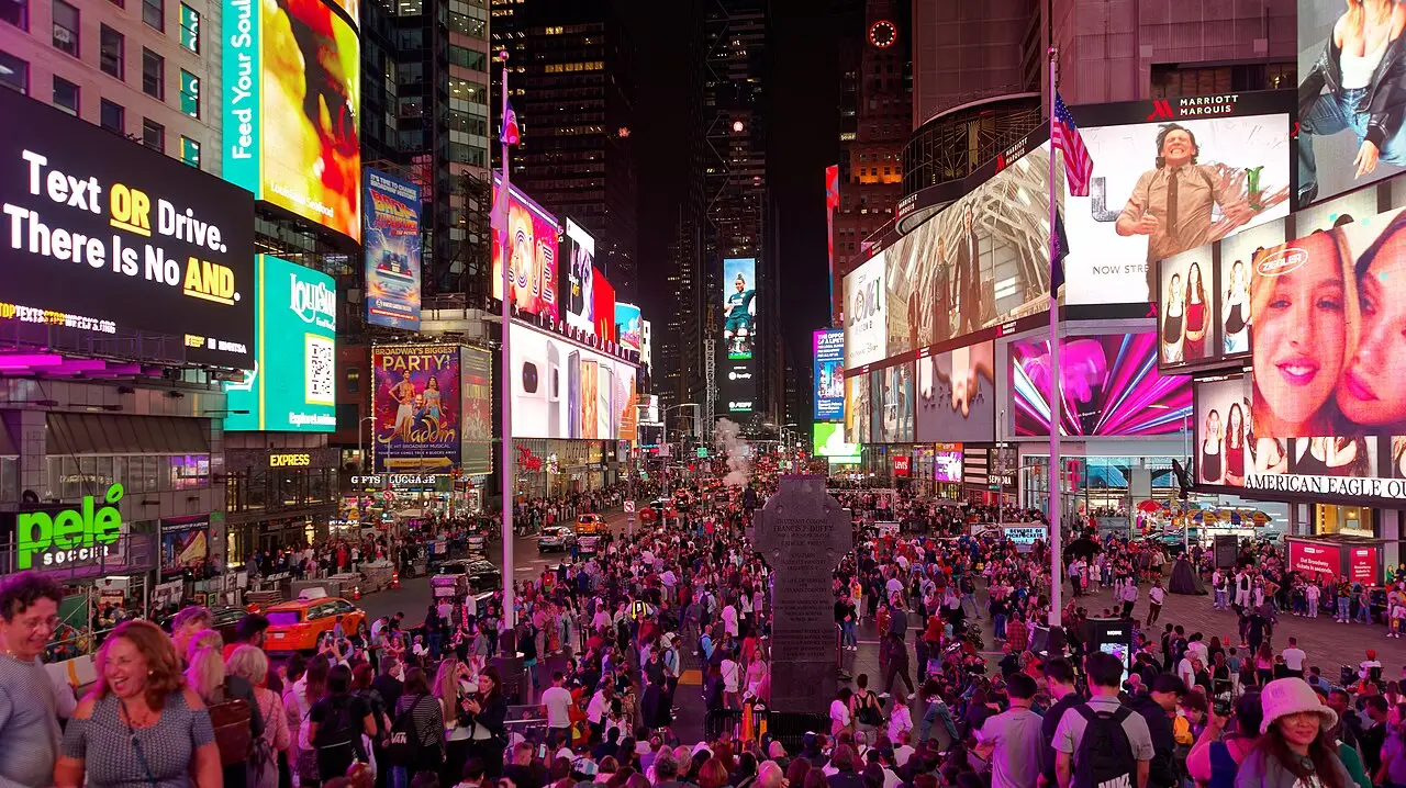The lights of Times Square and the Broadway theatre district at night