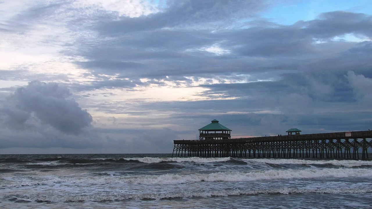 The wooden Folly Beach fishing pier extending into the Atlantic near Charleston