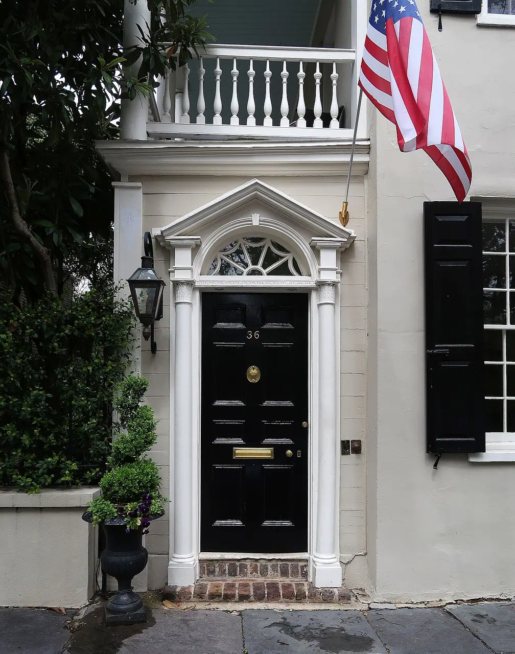 The Jane Wightman House, a historic brick building on cobblestoned Chalmers Street in Charleston