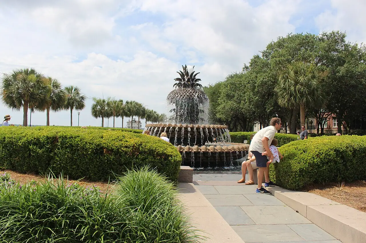 The Pineapple Fountain at Waterfront Park in Charleston with the harbor behind