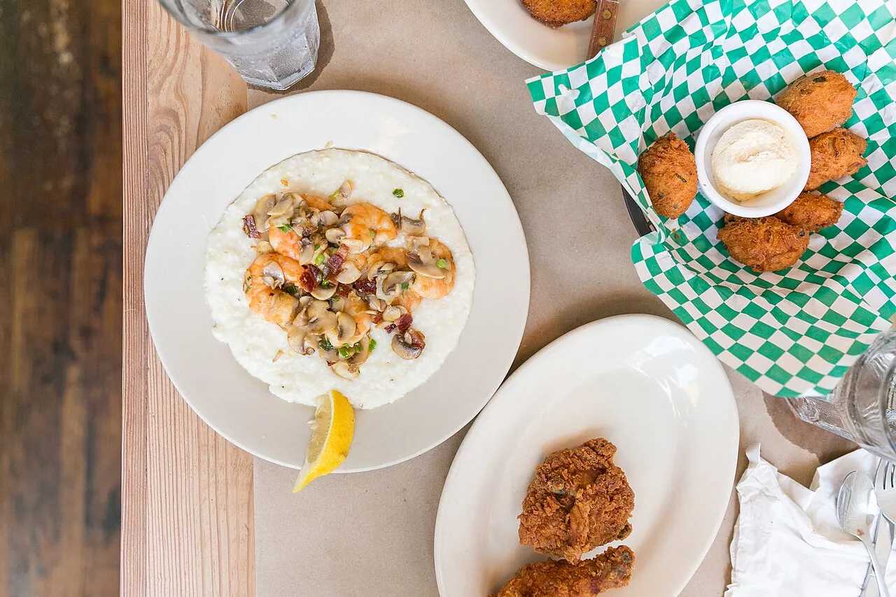 A plate of shrimp and grits with bacon and scallions at a Charleston restaurant