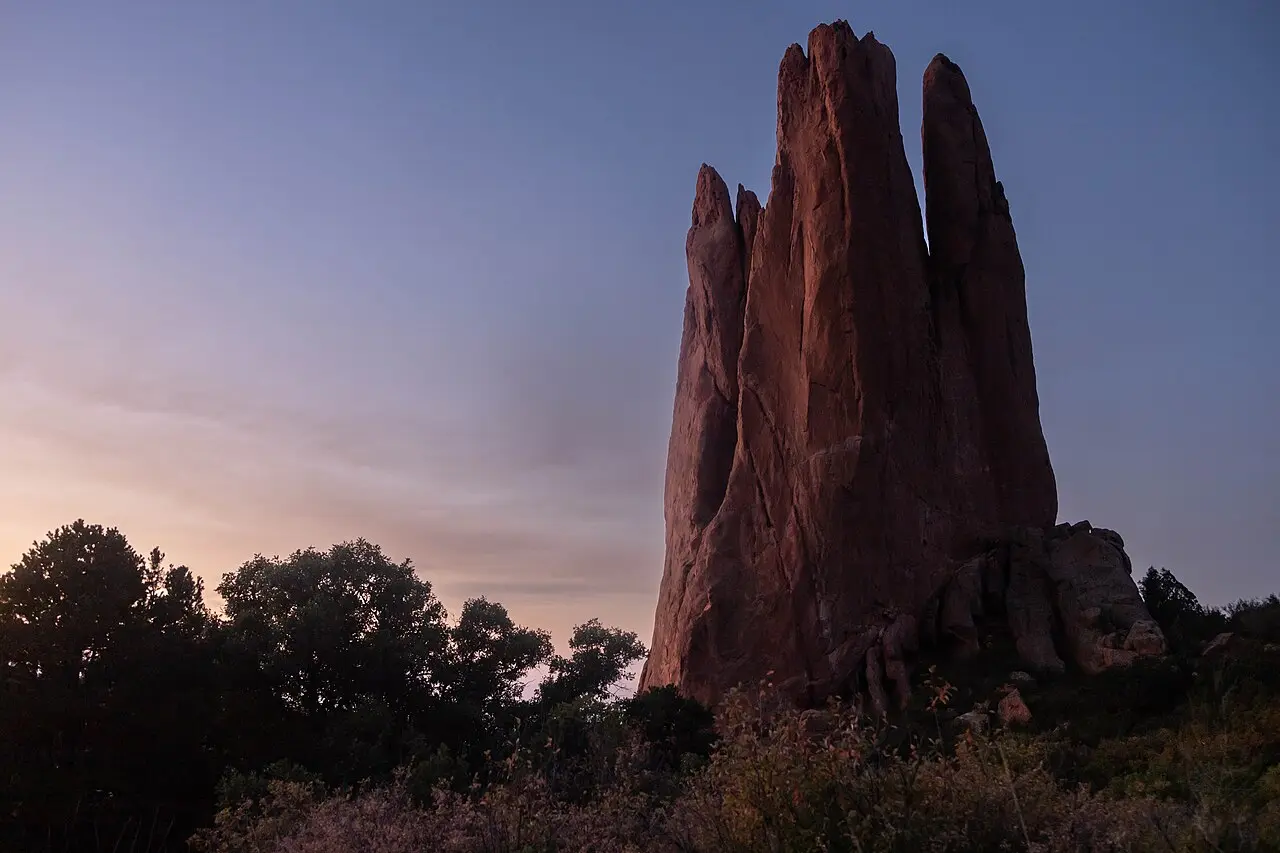 A red sandstone formation at Garden of the Gods in Colorado Springs at dusk