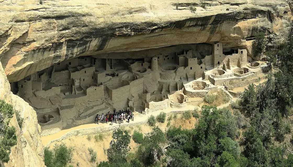 A ranger-guided tour group at Cliff Palace in Mesa Verde National Park, Colorado