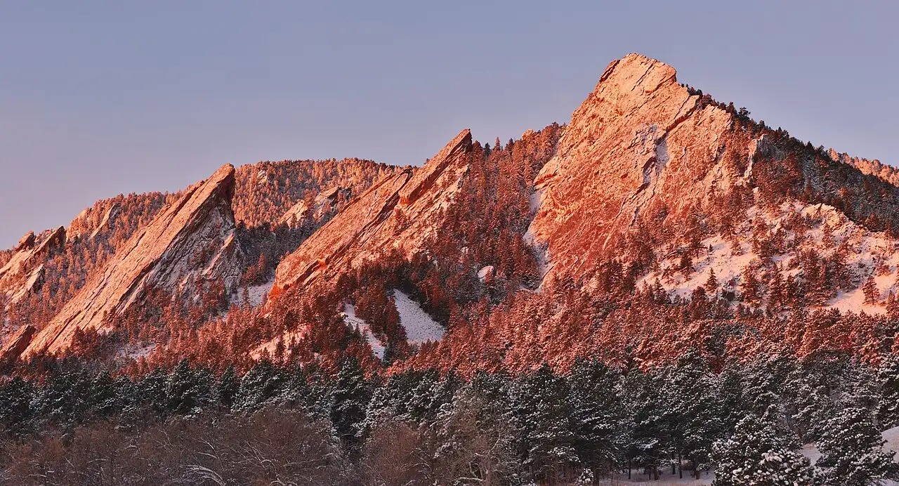 Sunrise light on the Flatirons rock formations above Boulder, Colorado