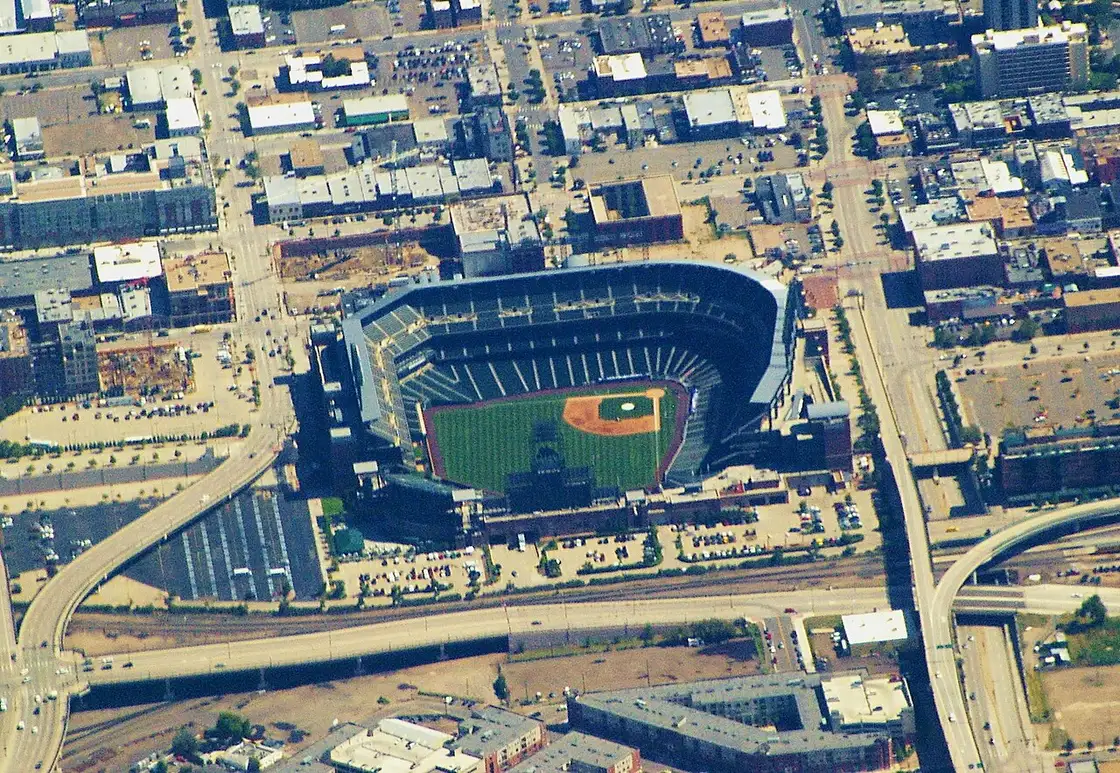 Coors Field baseball stadium in Denver with the city behind it
