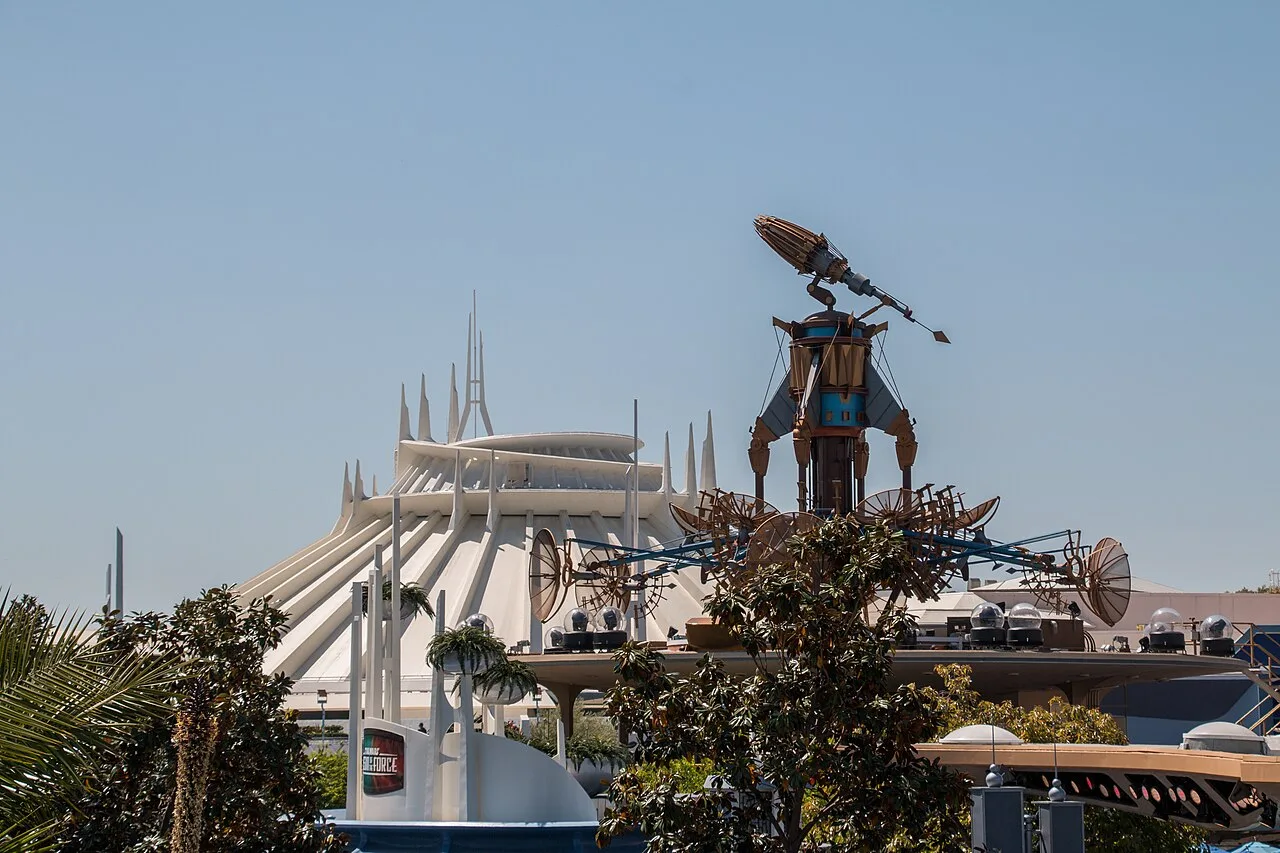 The white geodesic dome of Space Mountain at Disneyland Park against a blue sky