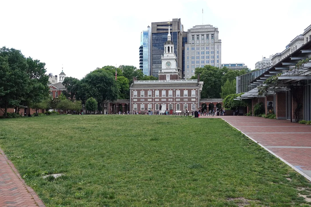 The red-brick facade and clock tower of Independence Hall in Philadelphia