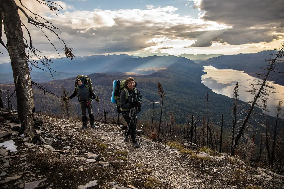 Hikers on a ridge above Lake McDonald in Glacier National Park
