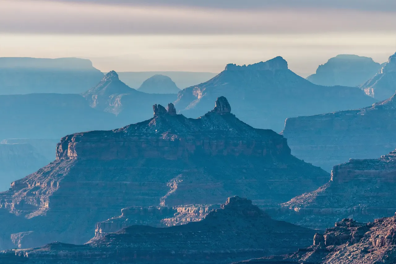 Hazy layered buttes and rock formations around Angels Gate, a summit inside Grand Canyon National Park