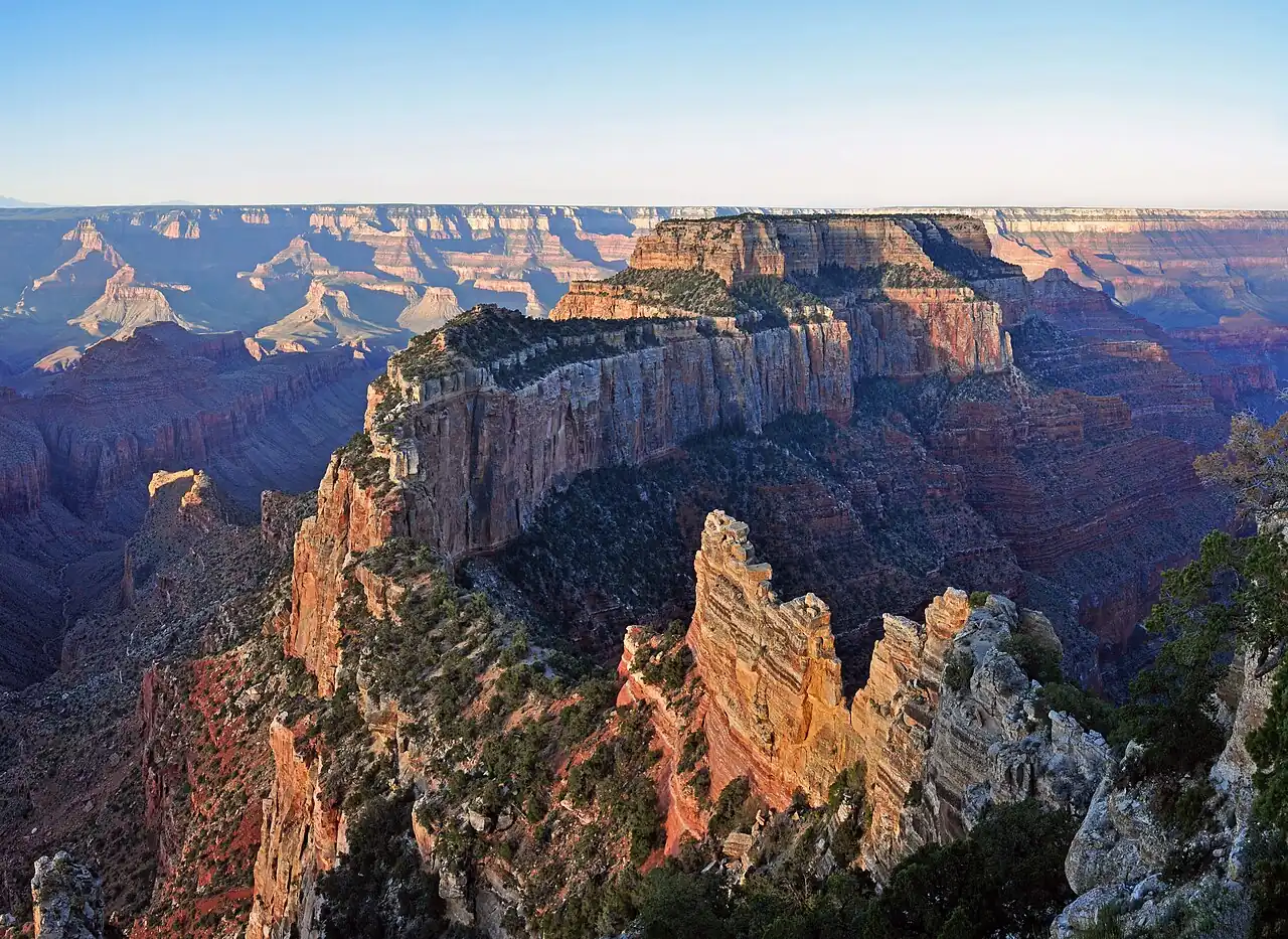 Muted sunrise colors over the canyon seen from Cape Royal on the North Rim