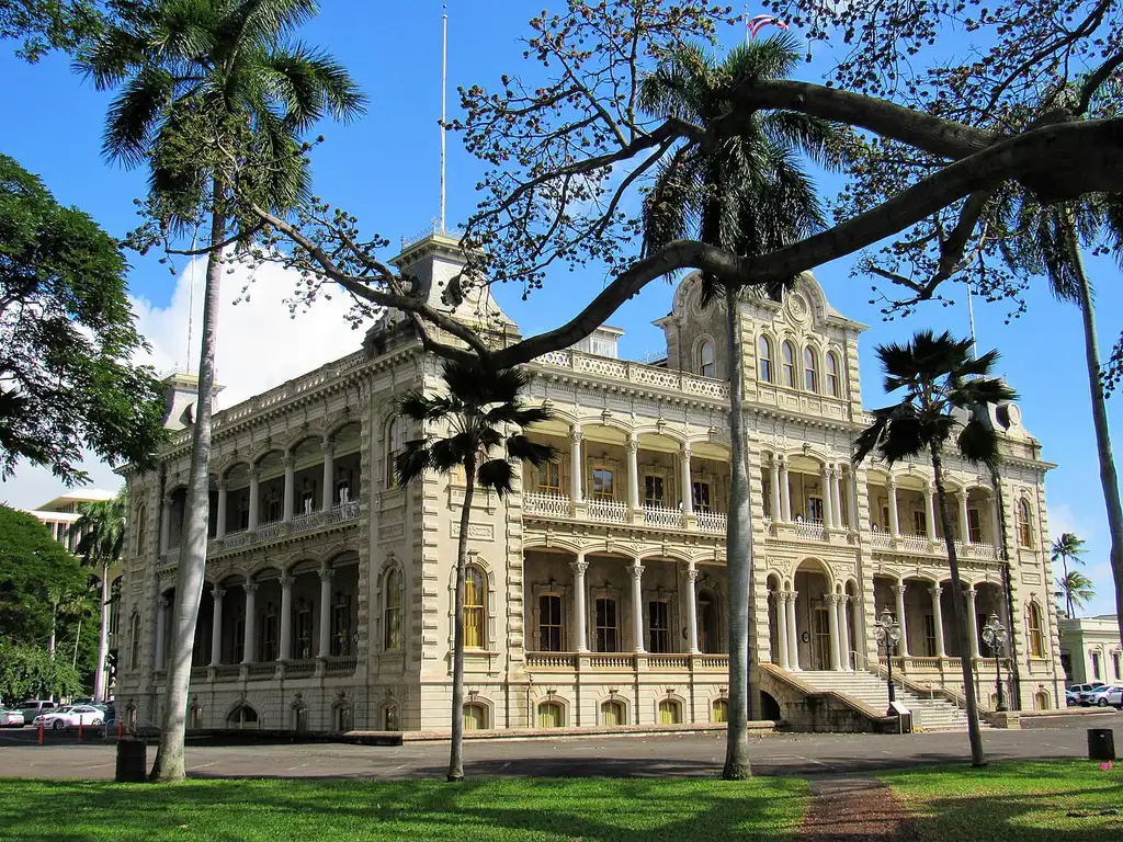 The ornate facade and verandas of Iolani Palace in downtown Honolulu