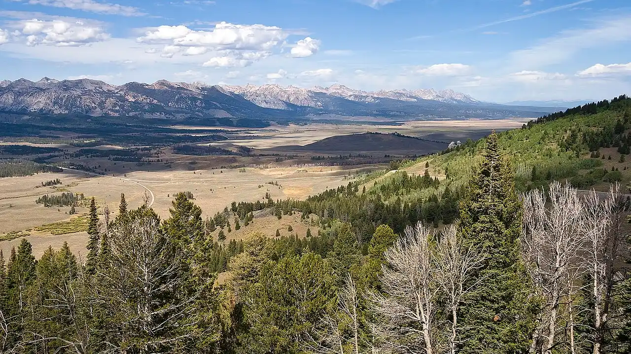 The Sawtooth Range rising above forested valleys in central Idaho