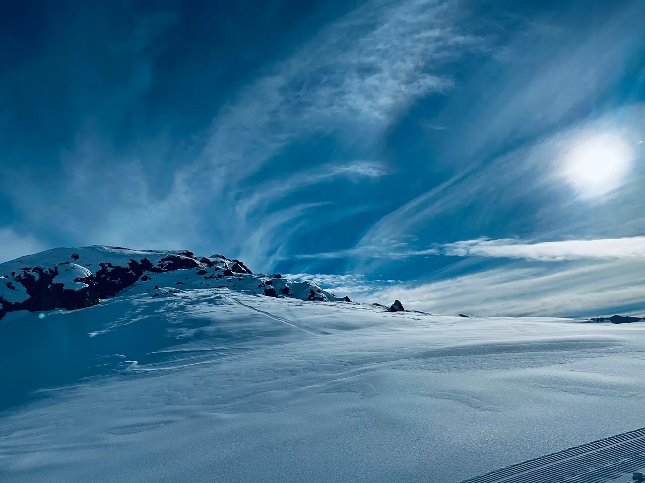 A skier descending a groomed run at Sun Valley Resort in Idaho