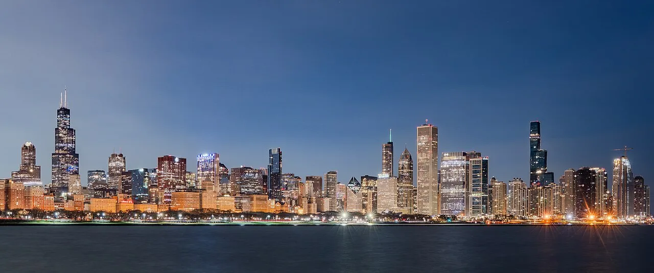 The Chicago skyline at sunrise seen across Lake Michigan