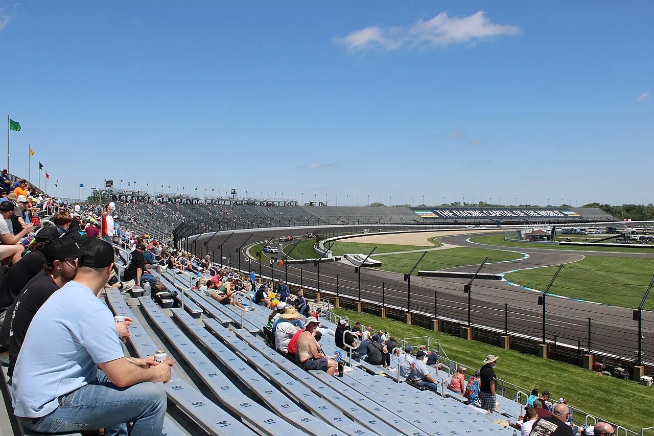 Grandstands and oval curve at Indianapolis Motor Speedway with Racing Capital of the World banner