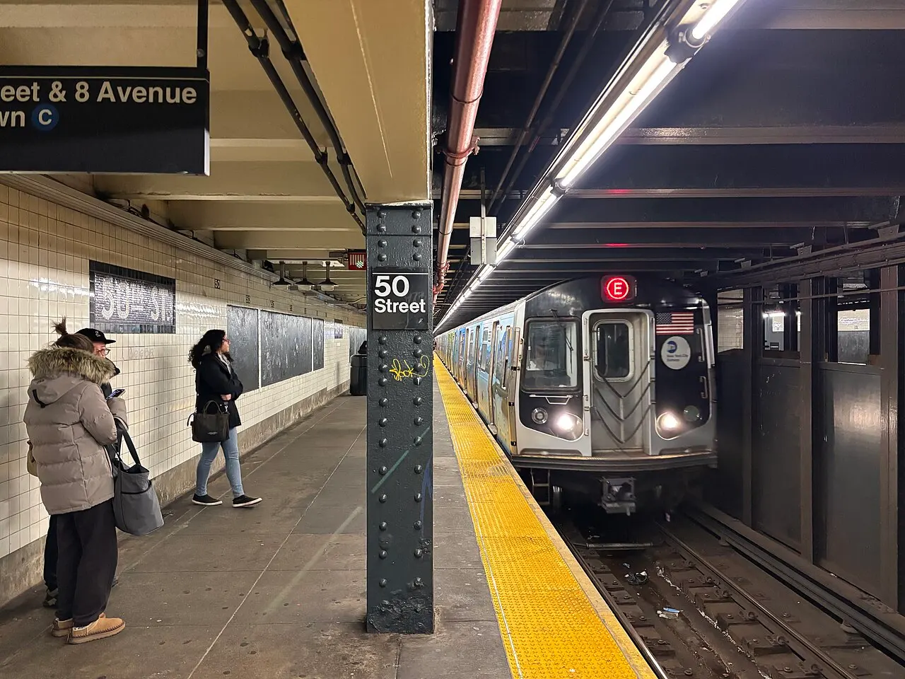 A subway platform at 50th Street station on the E train line in Manhattan