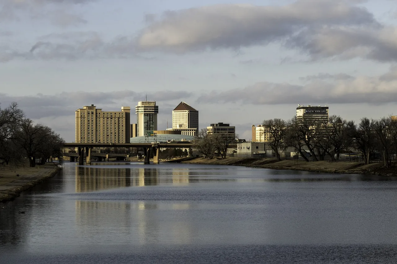 Downtown Wichita skyline with riverfront parkland in the foreground