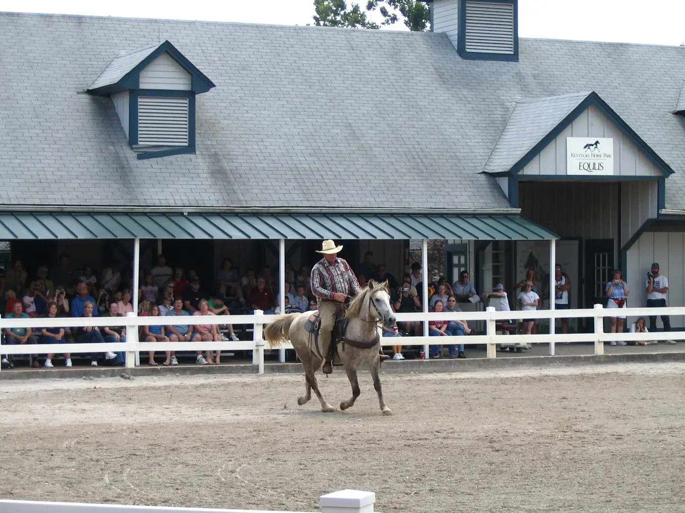 A rider on a dapple grey horse at the Kentucky Horse Park near Lexington