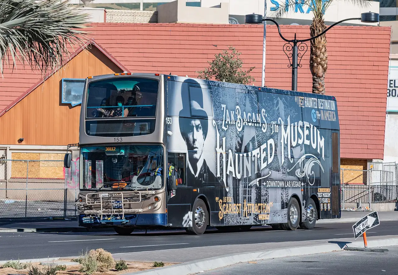 An RTC Deuce double-decker bus on Las Vegas Boulevard near The STRAT