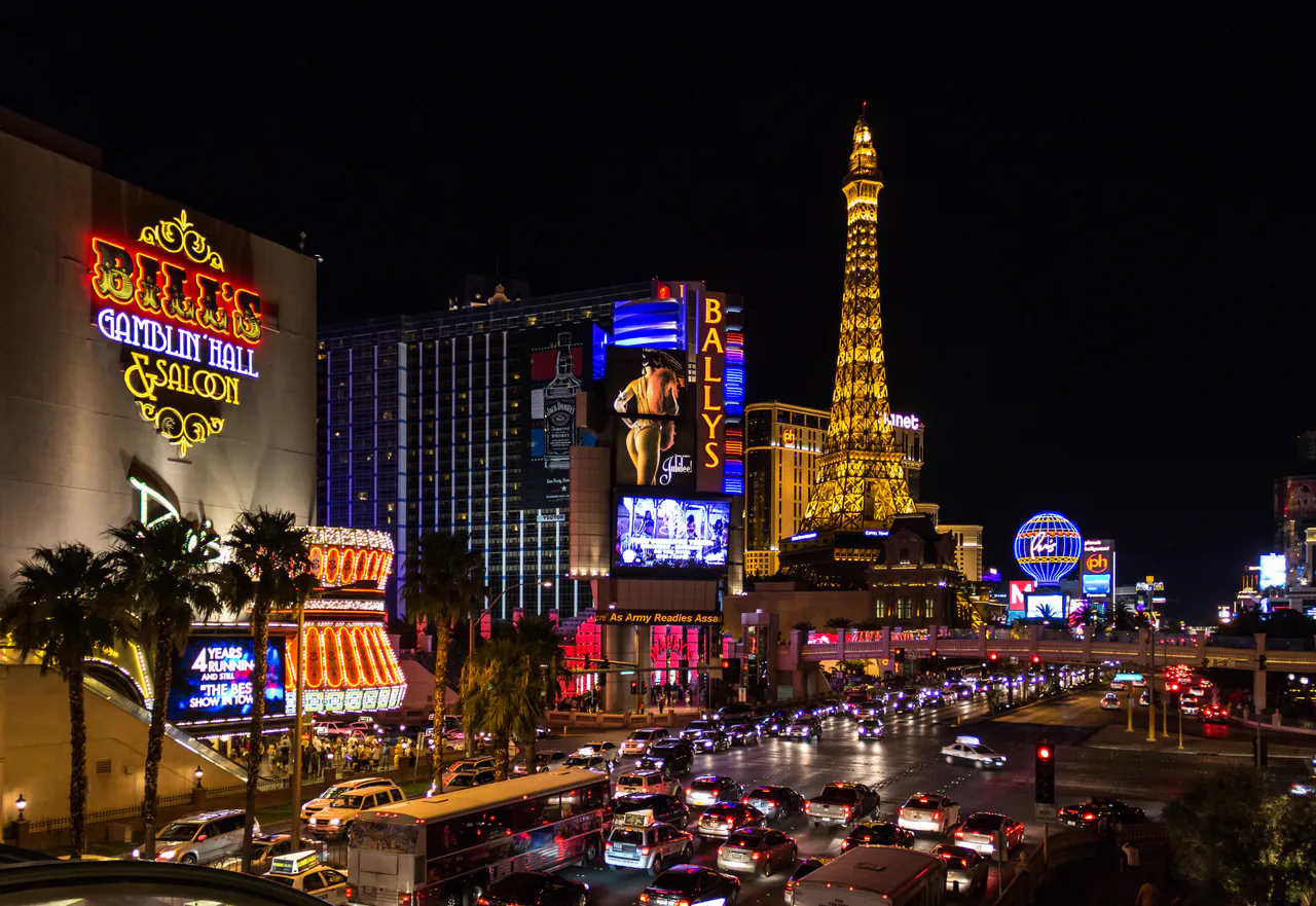 Casino resorts lining Las Vegas Boulevard on the Strip under an evening sky