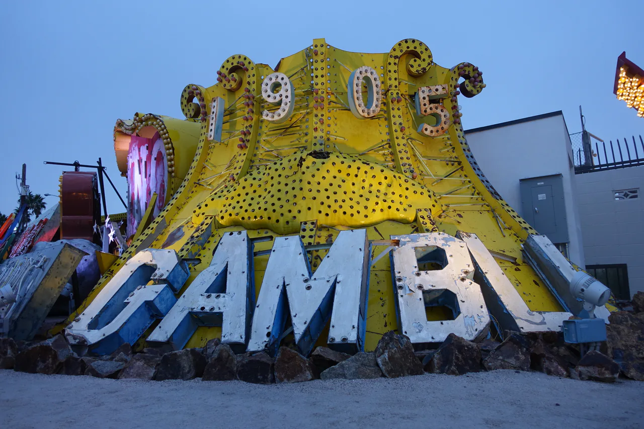 Salvaged neon casino signs standing in the outdoor boneyard of the Neon Museum in Las Vegas