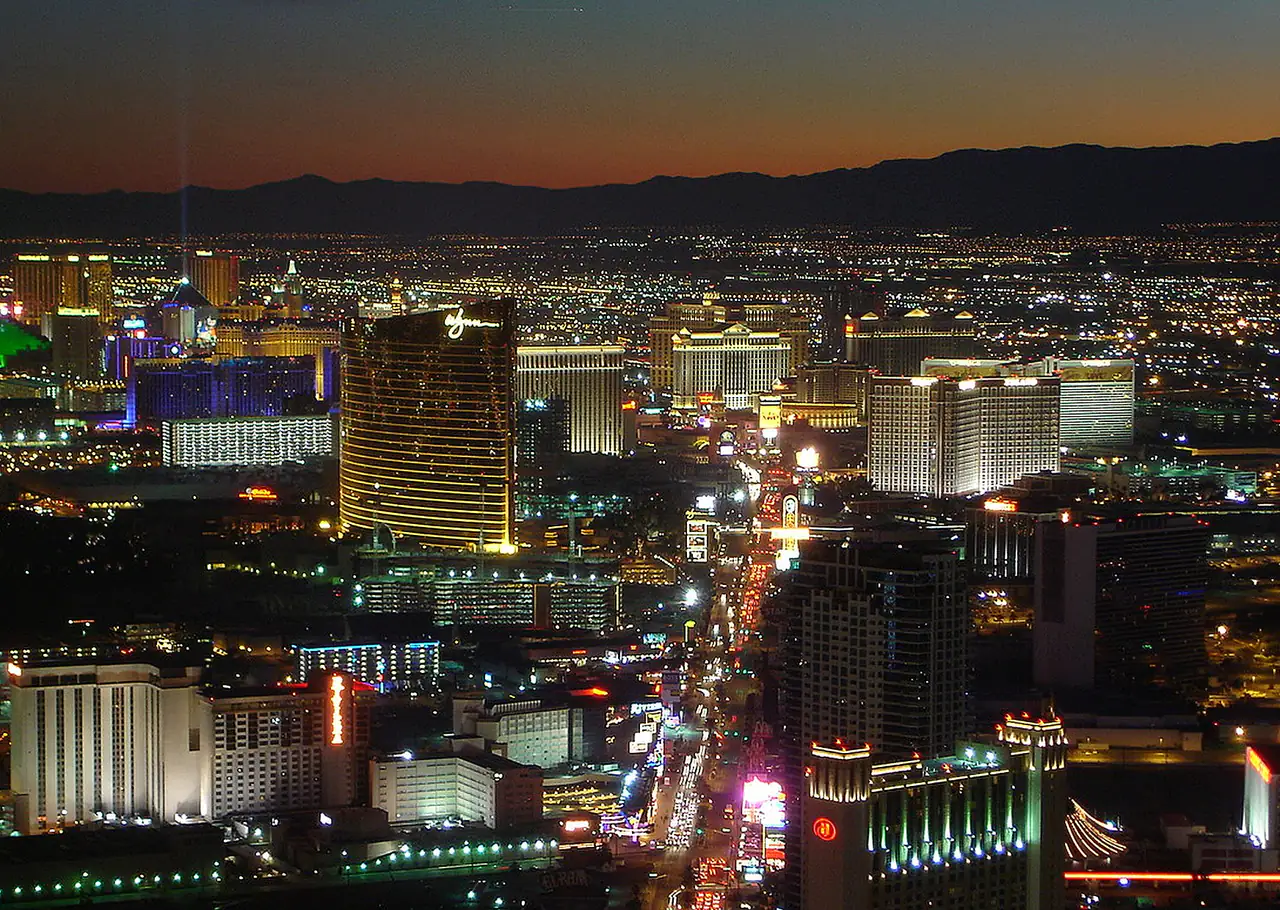 Daytime view along the Las Vegas Strip from a high vantage point showing hotel towers stretching south