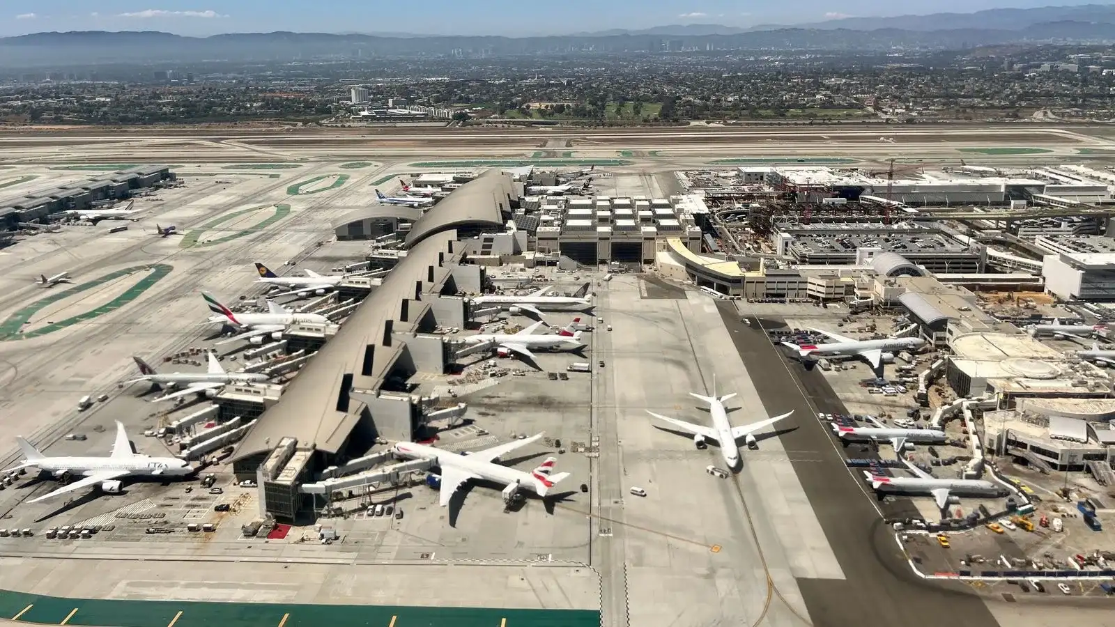 Aerial view of terminals and parked aircraft at Los Angeles International Airport