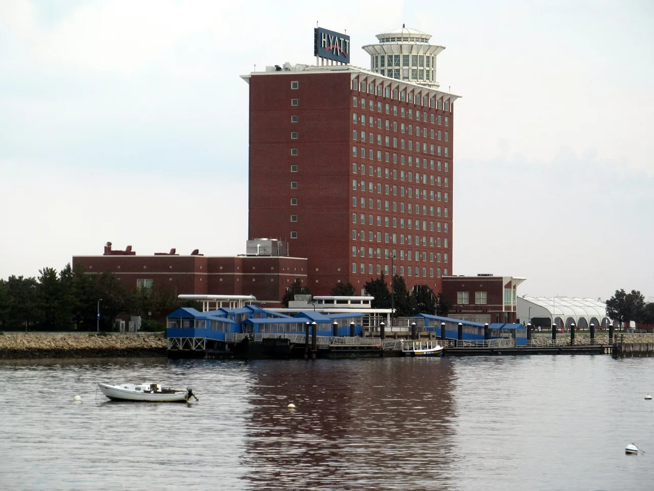 The Logan Airport ferry terminal dock on Boston Harbor with the Hyatt Regency hotel behind it