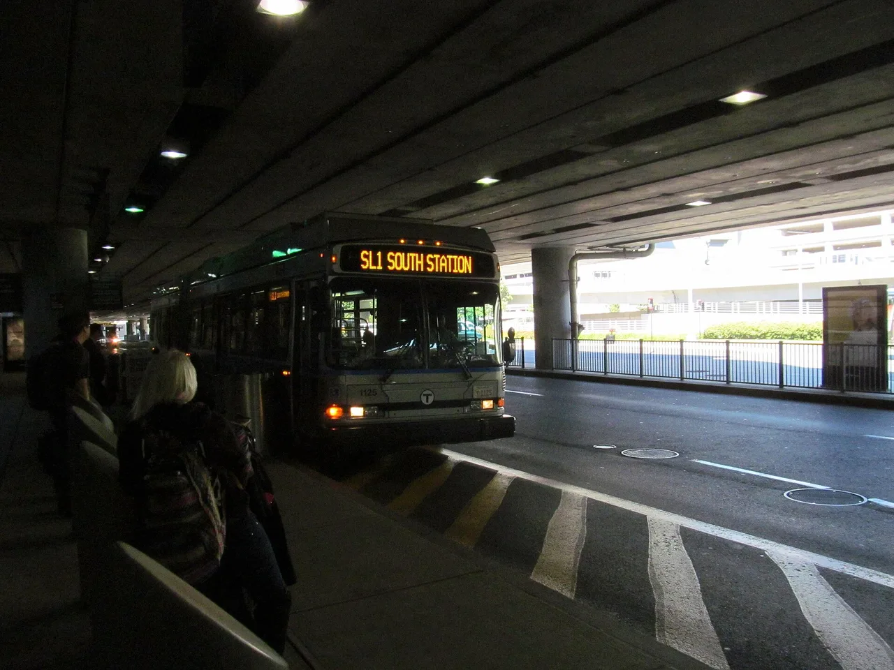 MBTA Silver Line SL1 bus boarding passengers at Logan Airport Terminal A