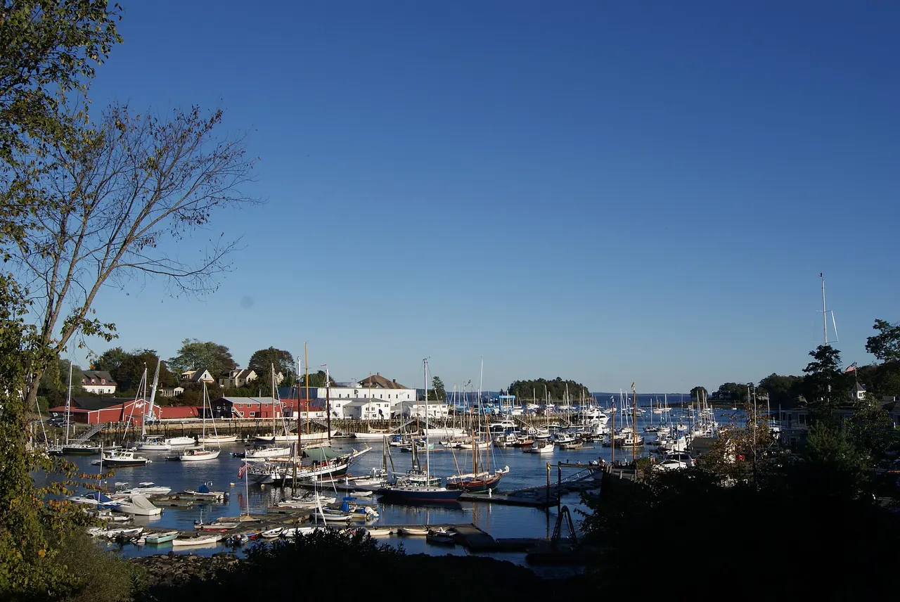 Sailboats and waterfront buildings around Camden Harbor, Maine