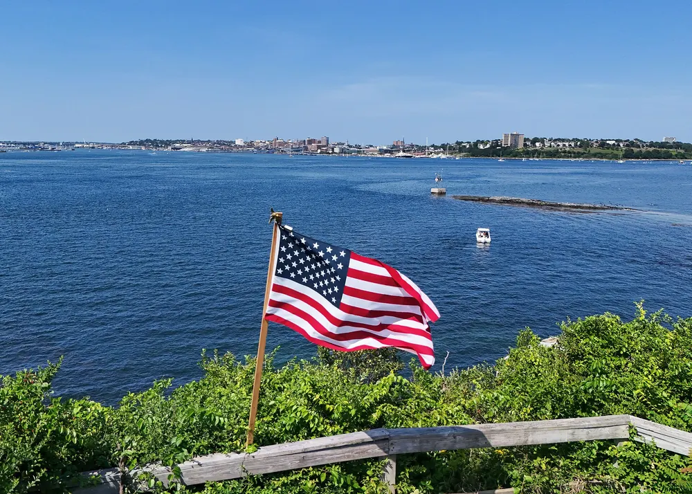 American flag flying over Fort Gorges in Portland Harbor