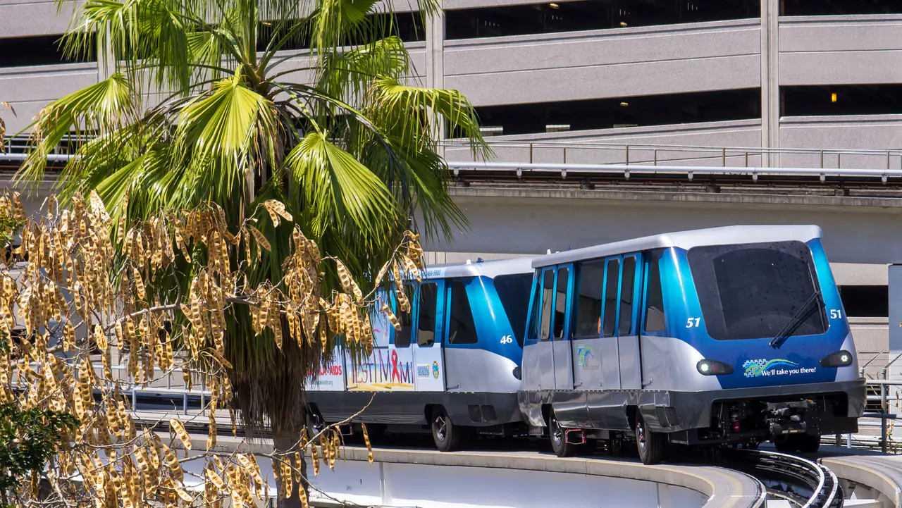 A driverless Metromover train on its elevated track in downtown Miami
