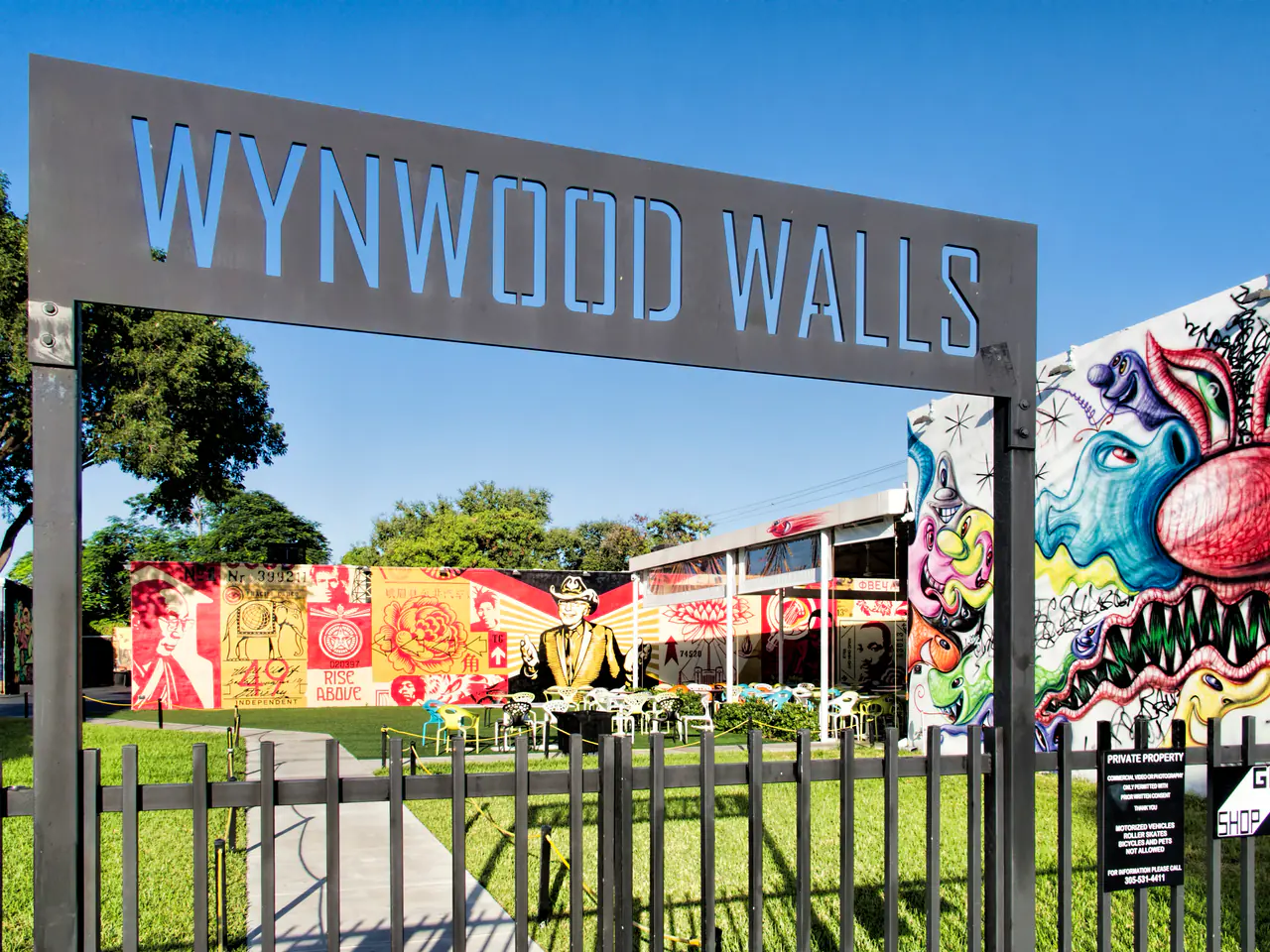 Large colorful murals covering the walls of the Wynwood Walls courtyard