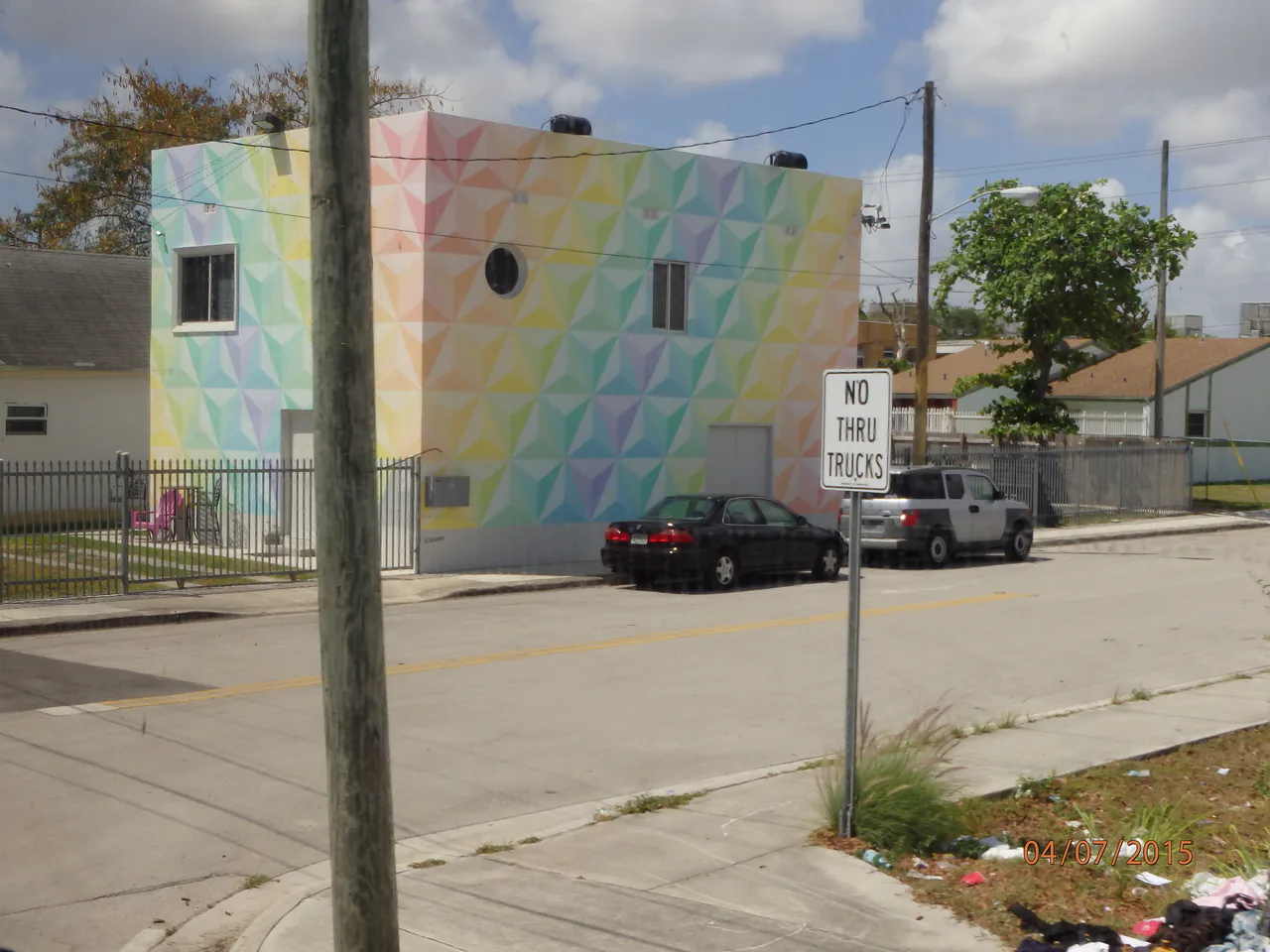 A painted warehouse wall and street scene in the Wynwood arts district of Miami