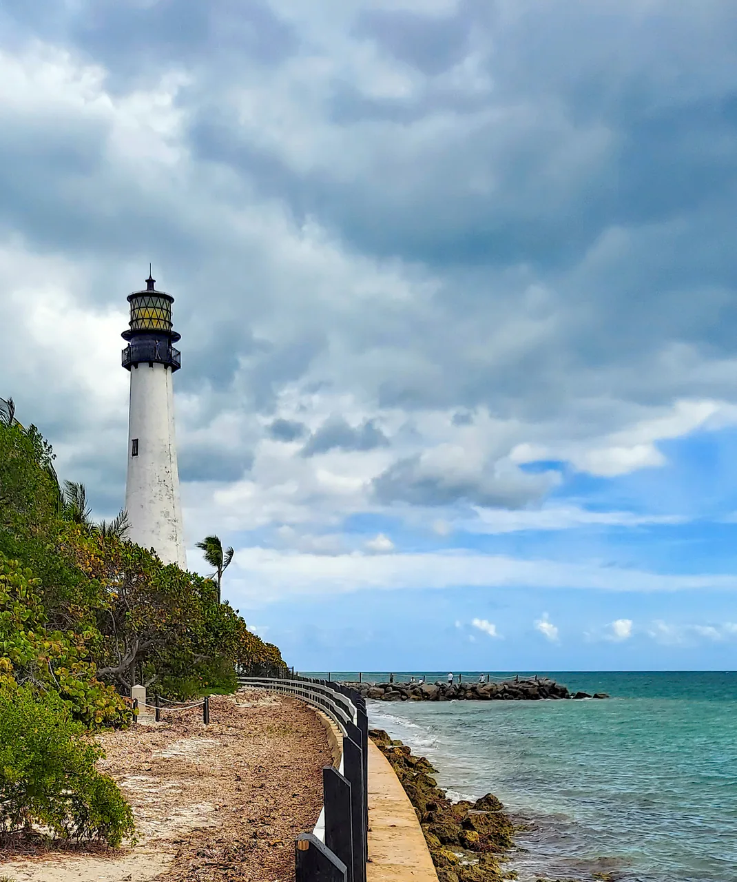 The white Cape Florida Lighthouse rising above palms on Key Biscayne