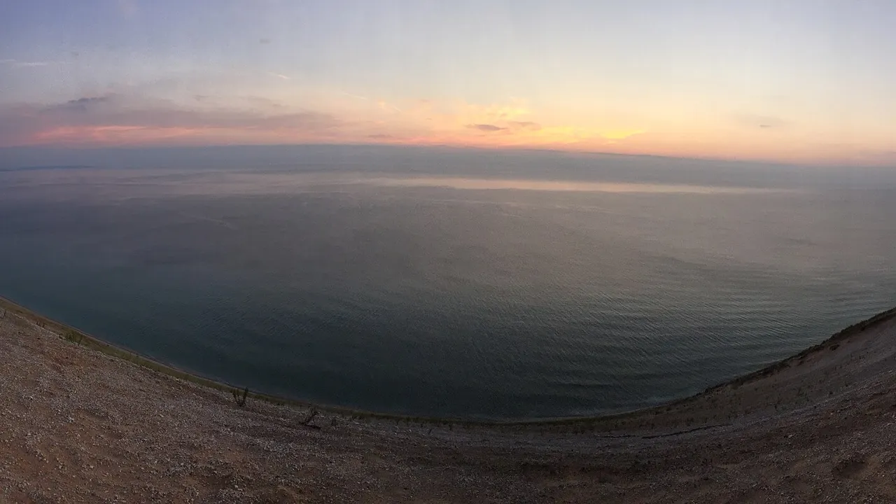 Lake Michigan stretching to the horizon from the Sleeping Bear Dunes bluff
