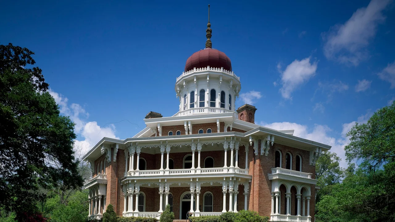The octagonal Longwood mansion and its red onion dome under a blue sky in Natchez, Mississippi